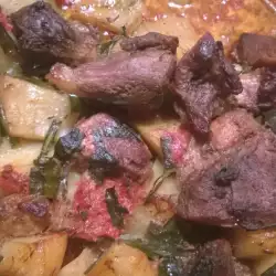 Свинско месо с картофи и пресен лук на фурна