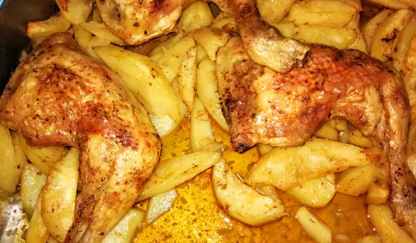 Печени пилешки бутчета с гарнитура от картофи