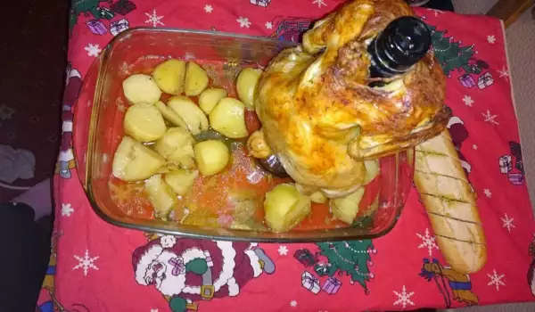 Пиле върху шише и печени картофки