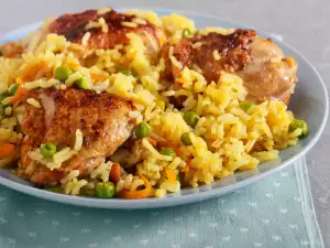 Пилешки бутчета с ориз и грах на фурна