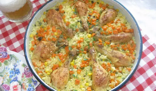 Пилешки бутчета с жълт ориз, царевица и моркови